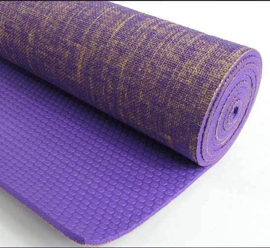 A purple and gold jute yoga mat from Kakaos