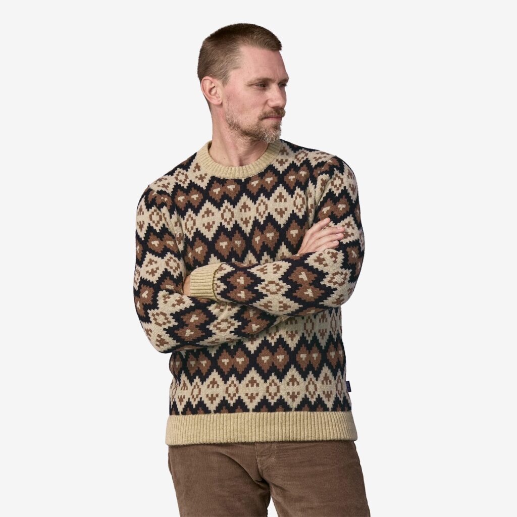 A man wearing a brown patterned, washable wool sweater from Patagonia