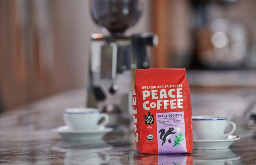 A red bag of Peace Coffee organic fair trade espresso on a countertop