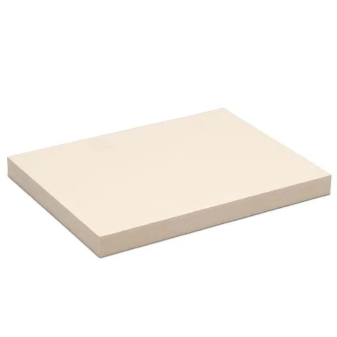 Cream-colored rubber cutting board with a durable, thick design.