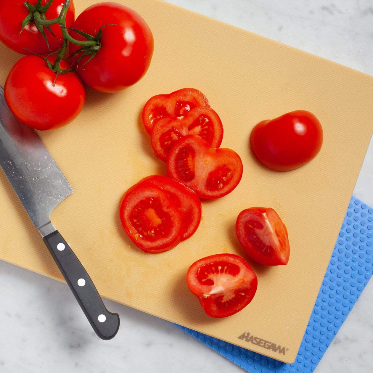 Hasegawa wood-core soft rubber cutting board with durable, lightweight design.