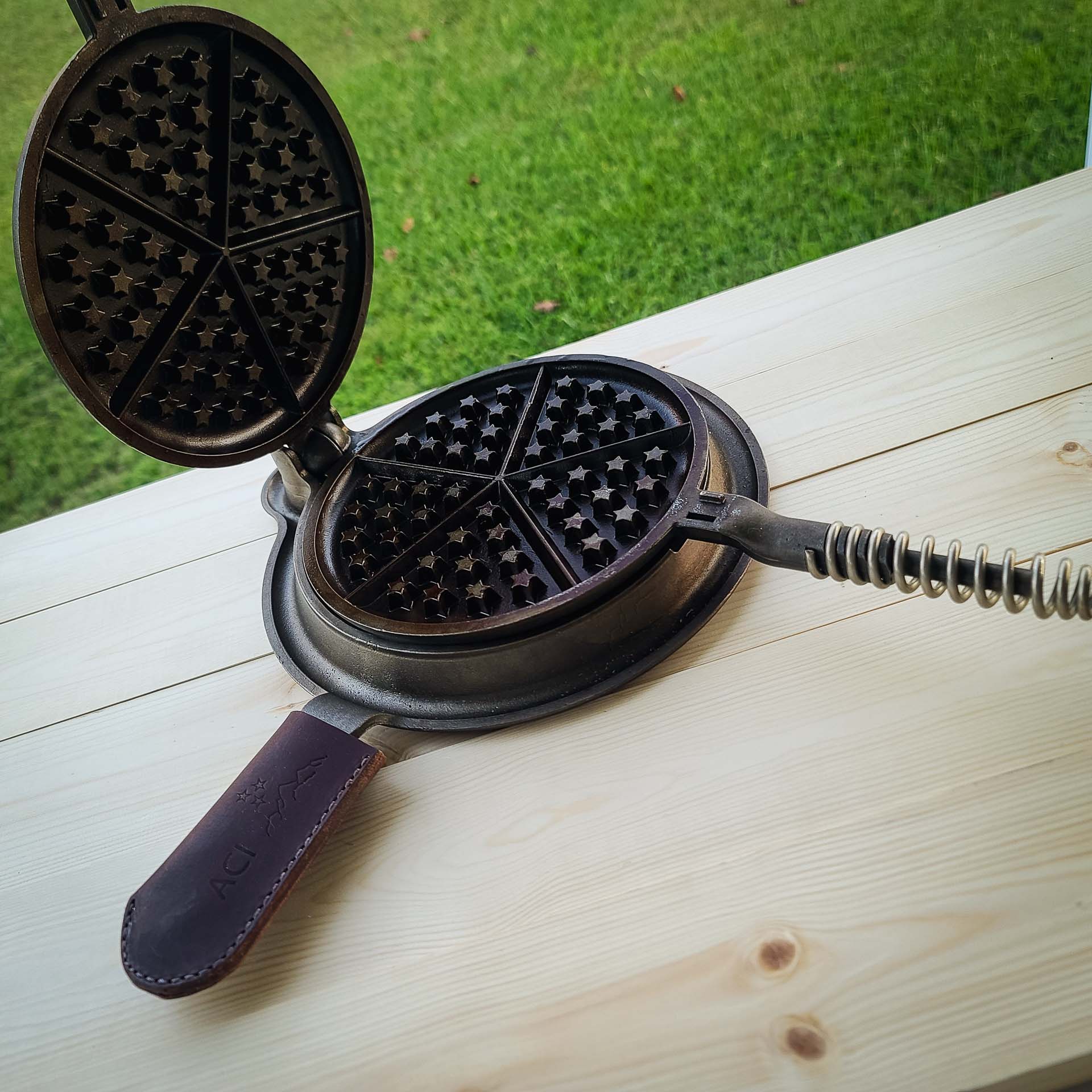 Great American Waffle Iron: Non Toxic Waffle Maker sitting open on a table outside 