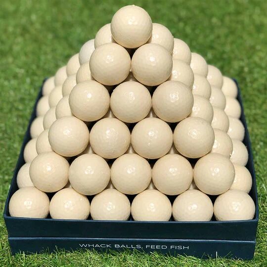 A pyramid made of eco-friendly fish food golf balls from Ocean Golf Asia